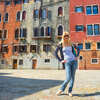 Attractive girl on a background of old houses in Venice, Italy.jpg