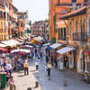Lively trading in the market one of streets of Venice, Italy.jpg
