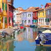 colorful houses by the water canal at the island Burano near venice, Italy.jpg