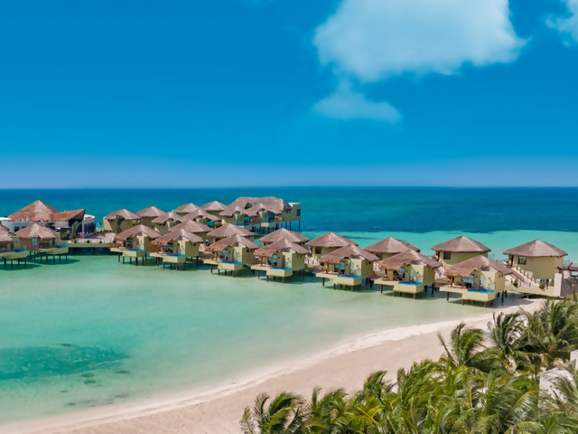 Discover Tropical Romance in 3 Overwater Bungalow Resorts on the Caribbean Sea